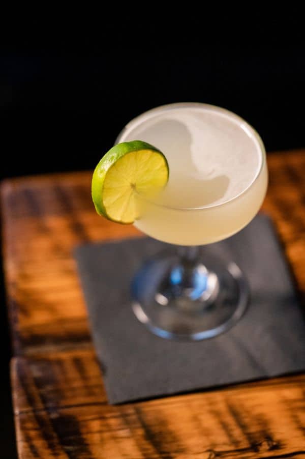 A fresh daiquiri cocktail in a coupe glass at the speakeasy