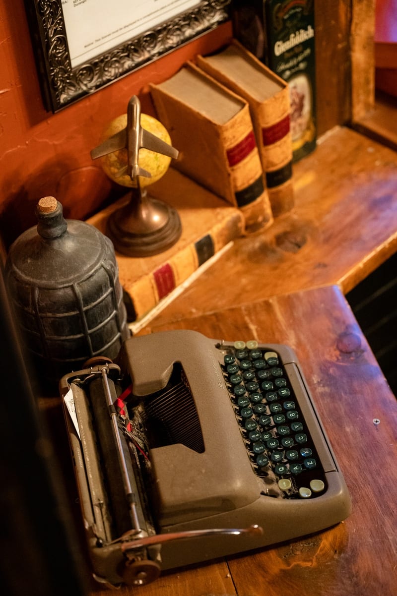 Bottle detail — bookcase spirits shelf